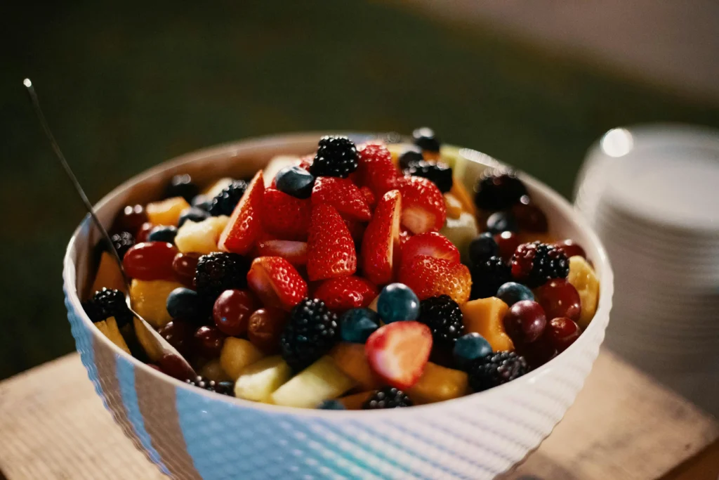 Refreshing and colorful Ensalada de Frutas in a white serving bowl