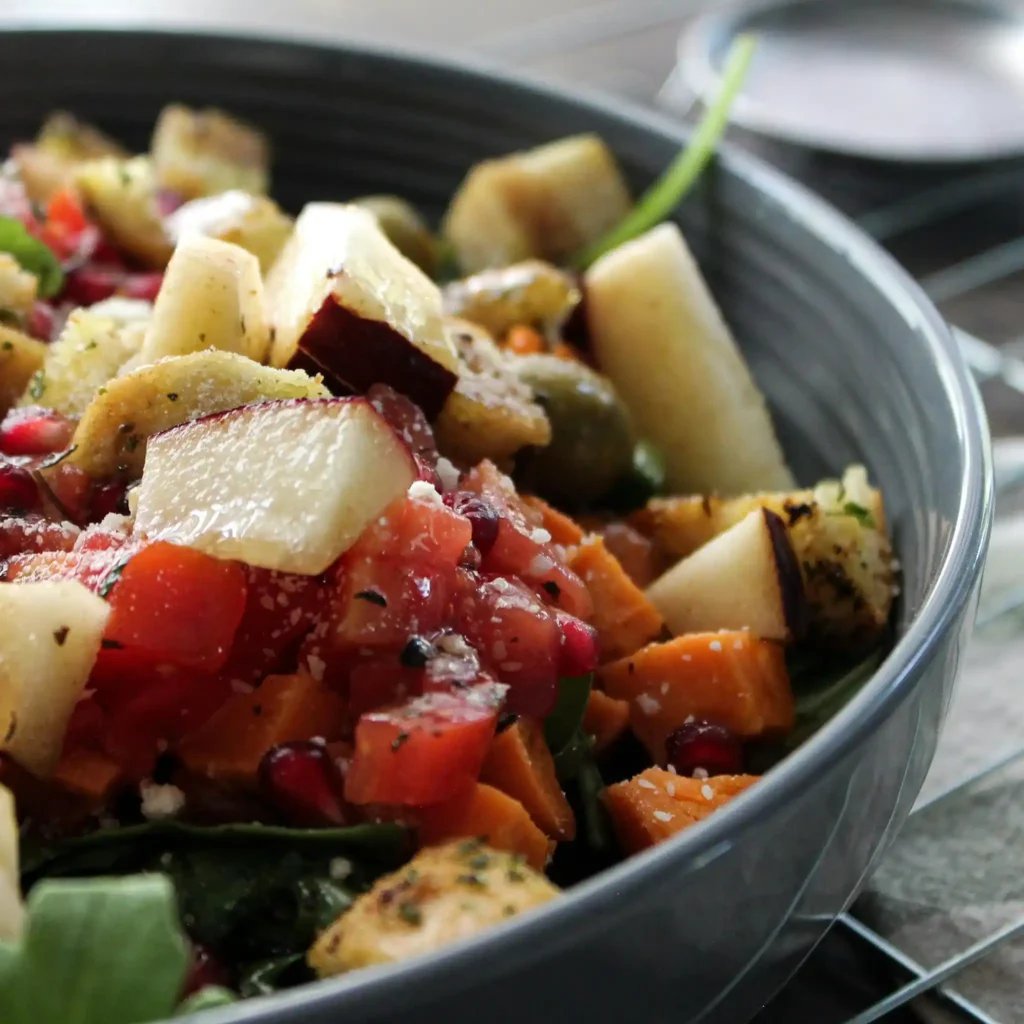 Warm sweet potato salad in a rustic serving bowl