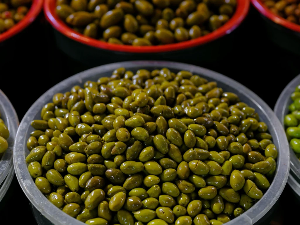 Fresh Green Olives in Market Close-Up