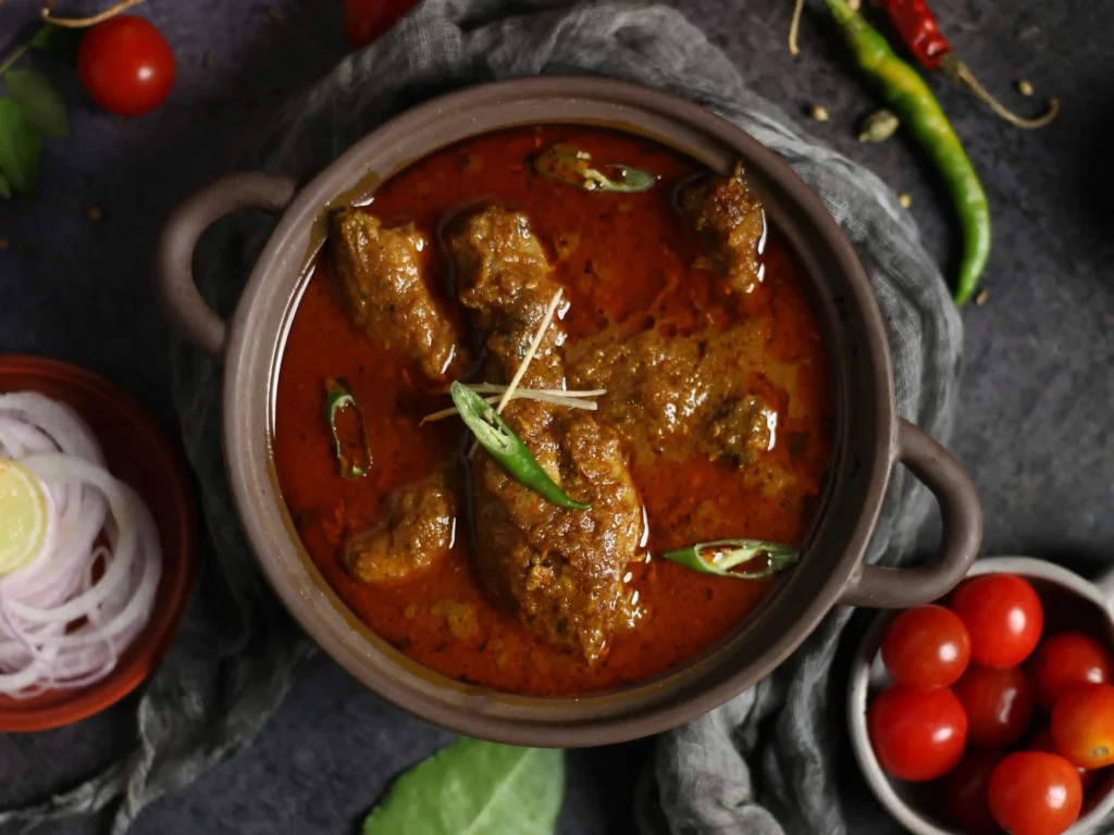 Freshly cooked Rogan Josh lamb curry garnished with coriander and ready to be served