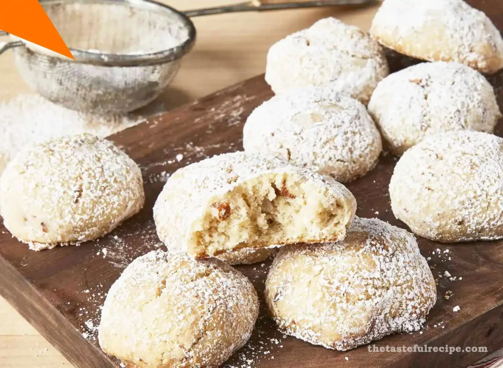 Hands shaping dough into round balls for Mexican Wedding Cookies