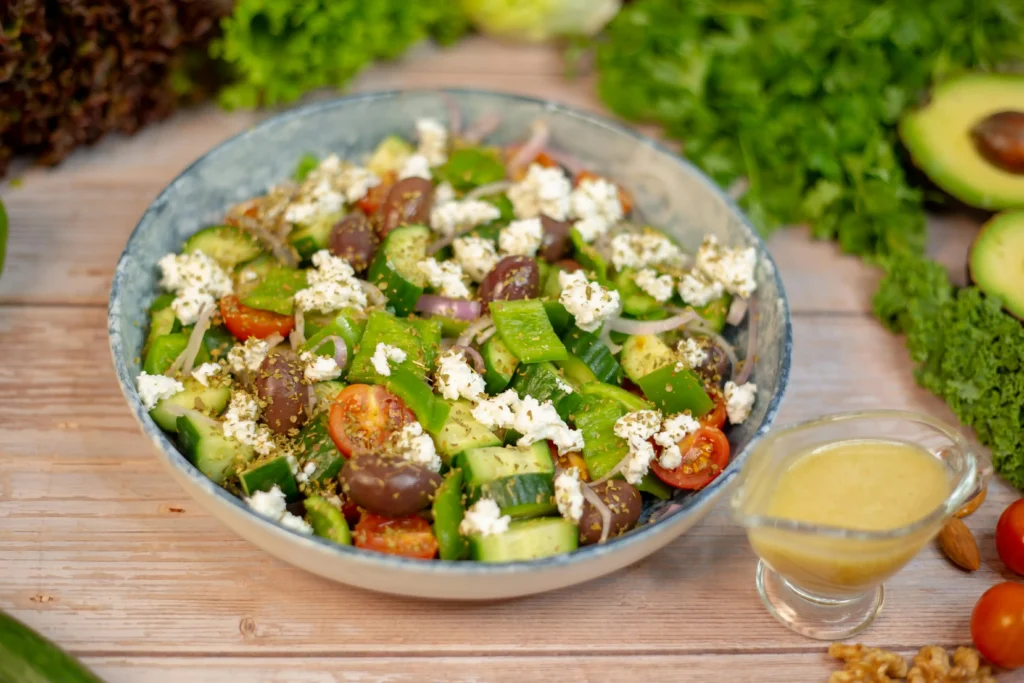 Waldorf Salad Recipe with vegetables and dressing on a wooden table