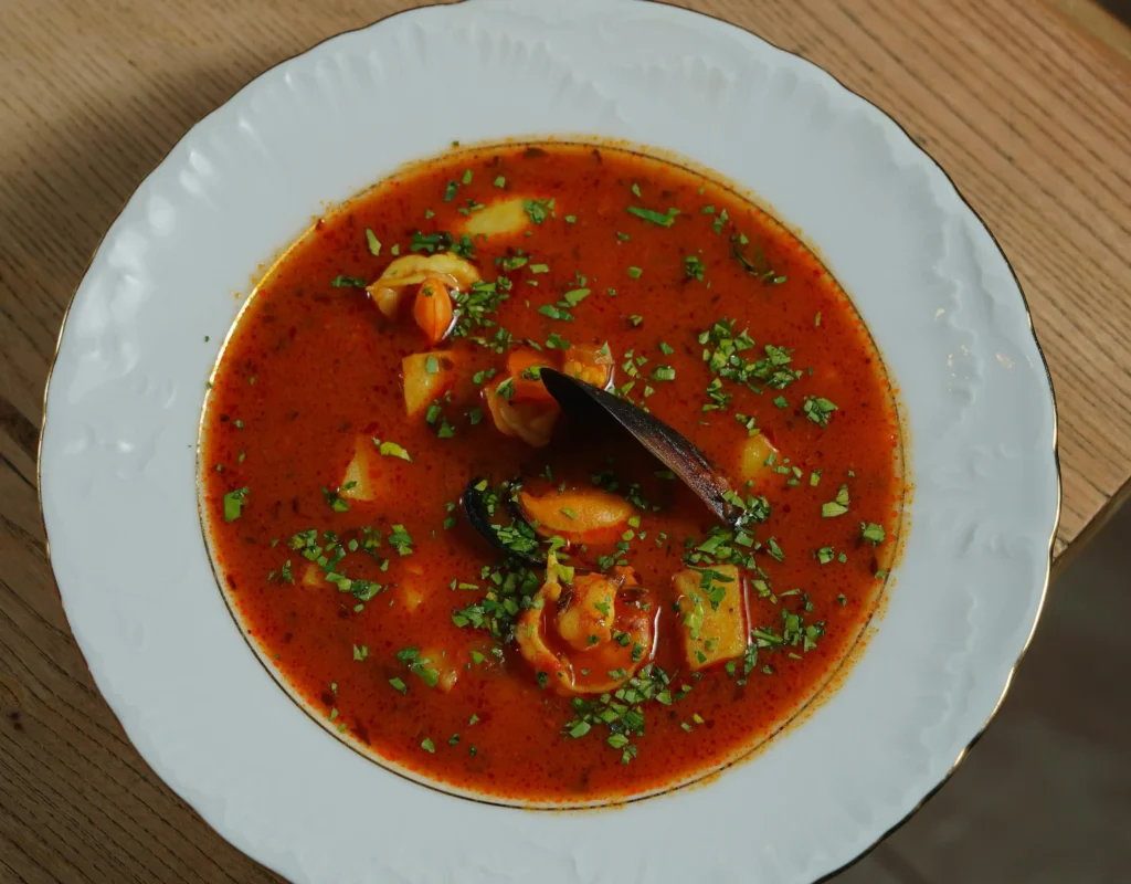 Bowl of traditional Louisiana gumbo with shrimp, sausage, and chicken served over rice