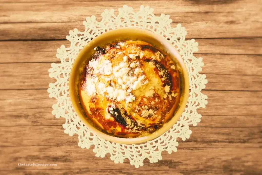 Rustic-style peach cobbler served with whipped cream in a dessert bowl